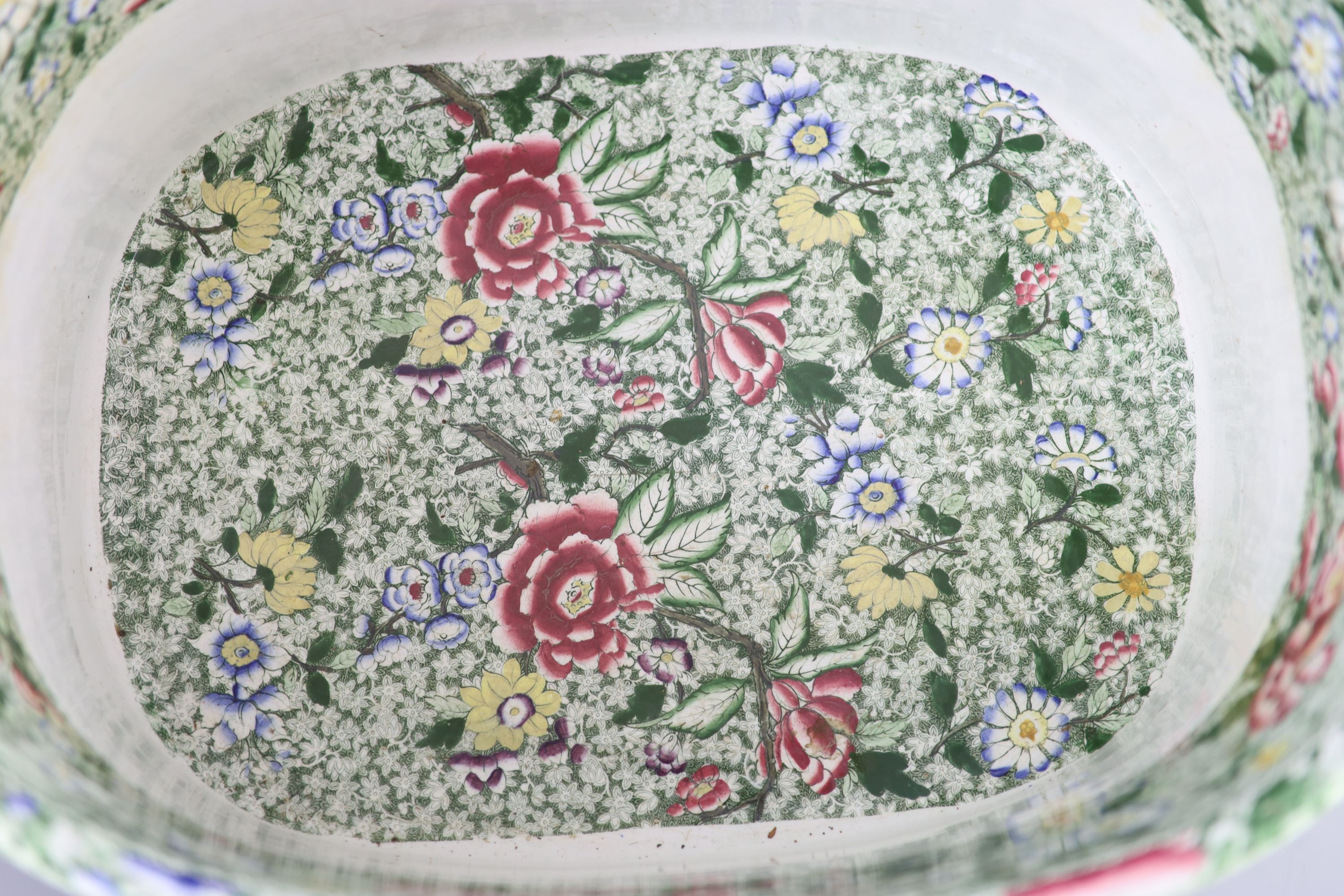 A Victorian ironstone two handled footbath, c.1840, 53cm across